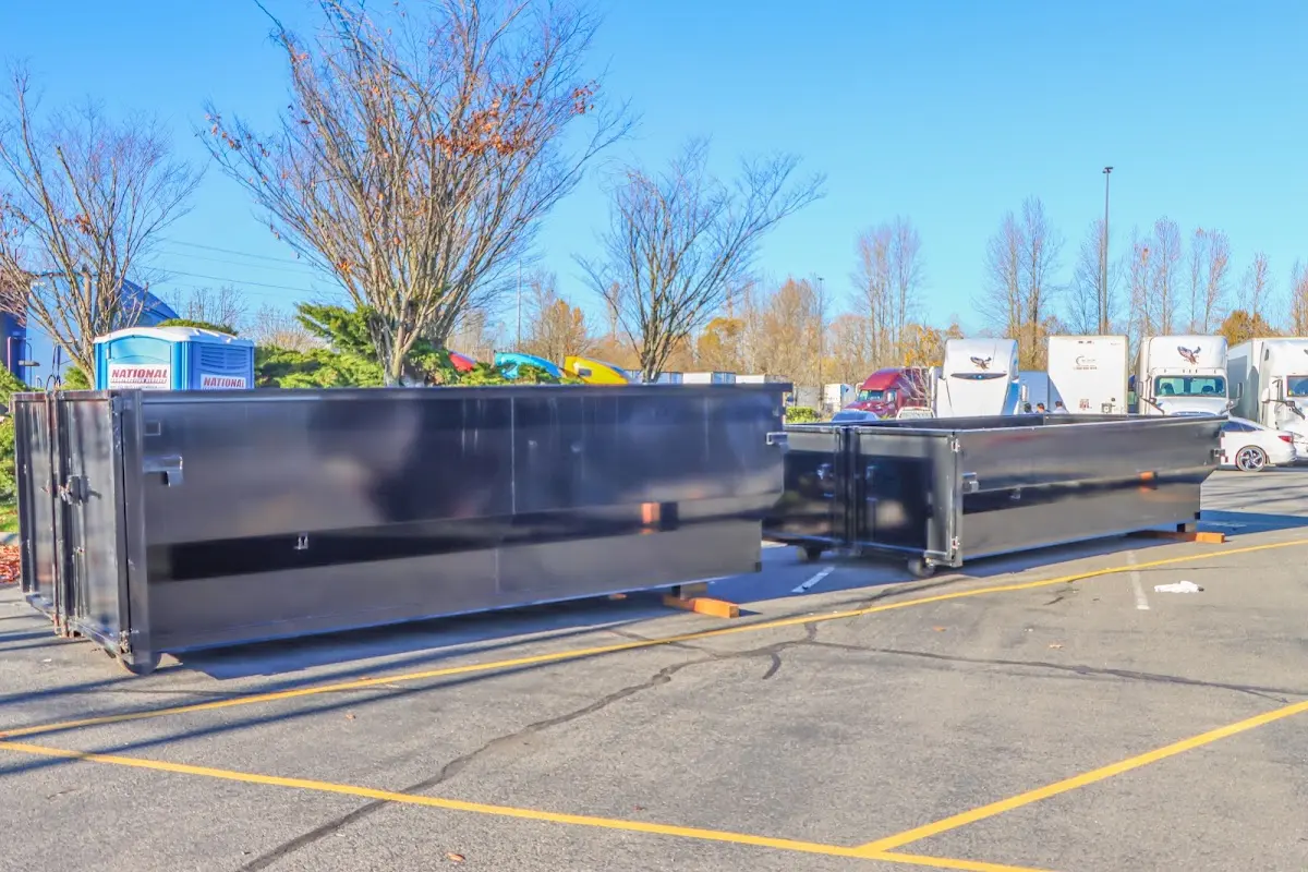 Professional dumpster rental service with roll-off container on residential driveway in Wappingers Falls